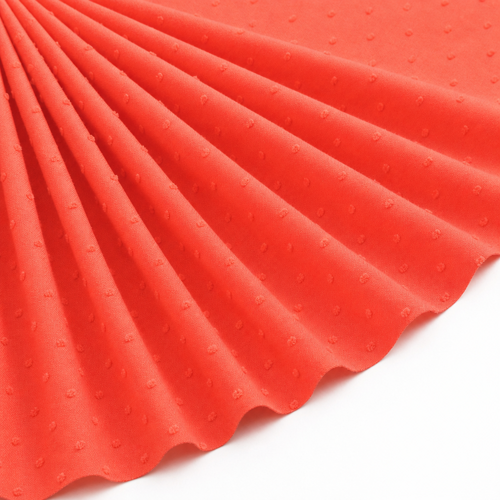 Tissu Voile de Coton Plumetis Corail
